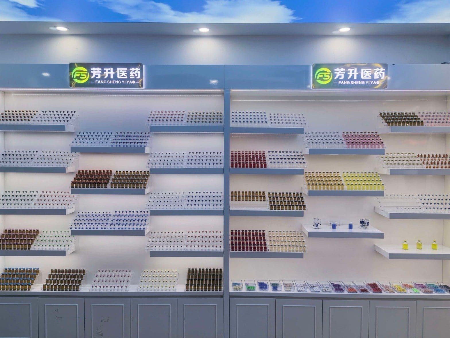 The Fangsheng showroom: a wall of sample vials in many cap and liquid colours